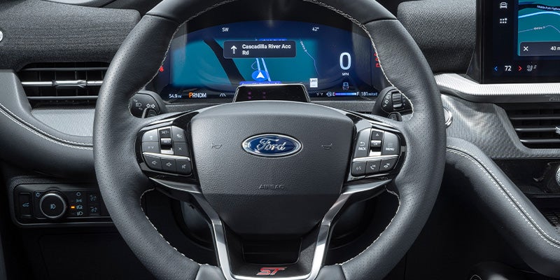 The view of the 2025 Ford Explorer steering wheel and dash.