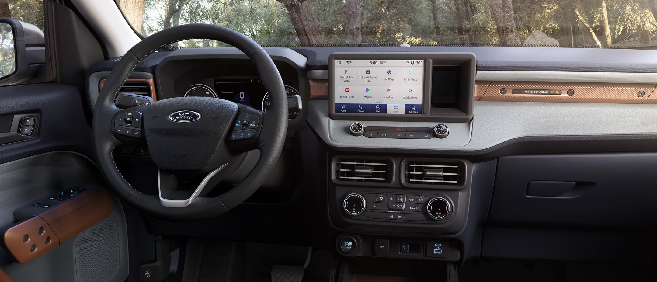 the front interior of a truck showing the display and drivers front