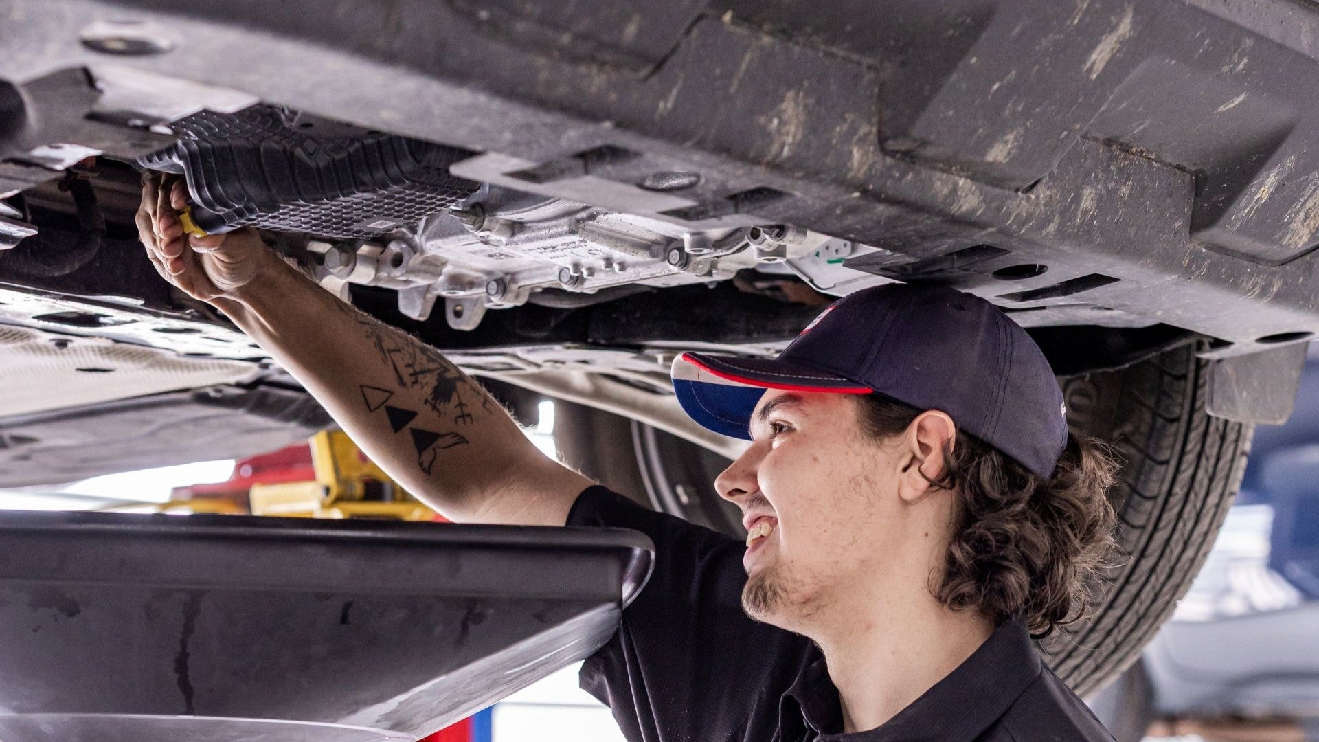 ford technician changing oil