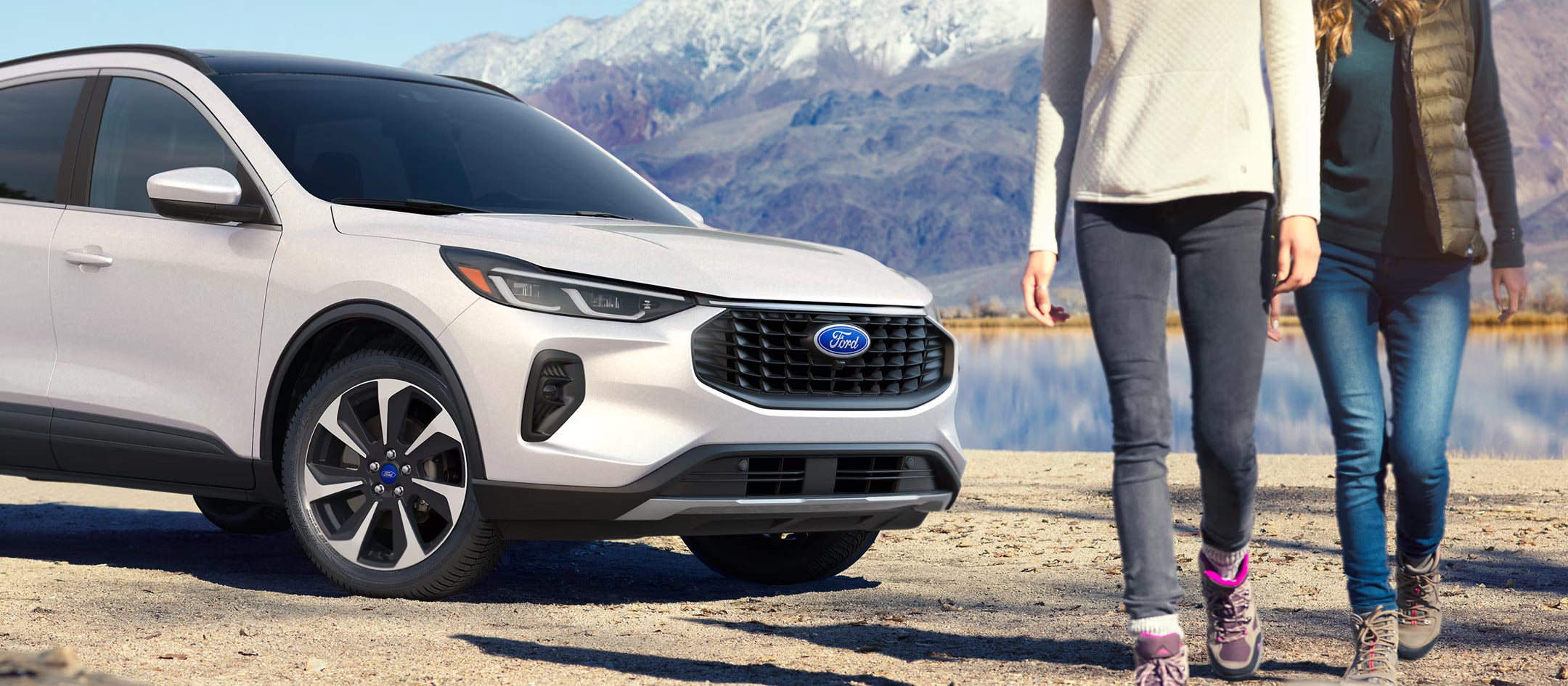 People walking away from a white escape.