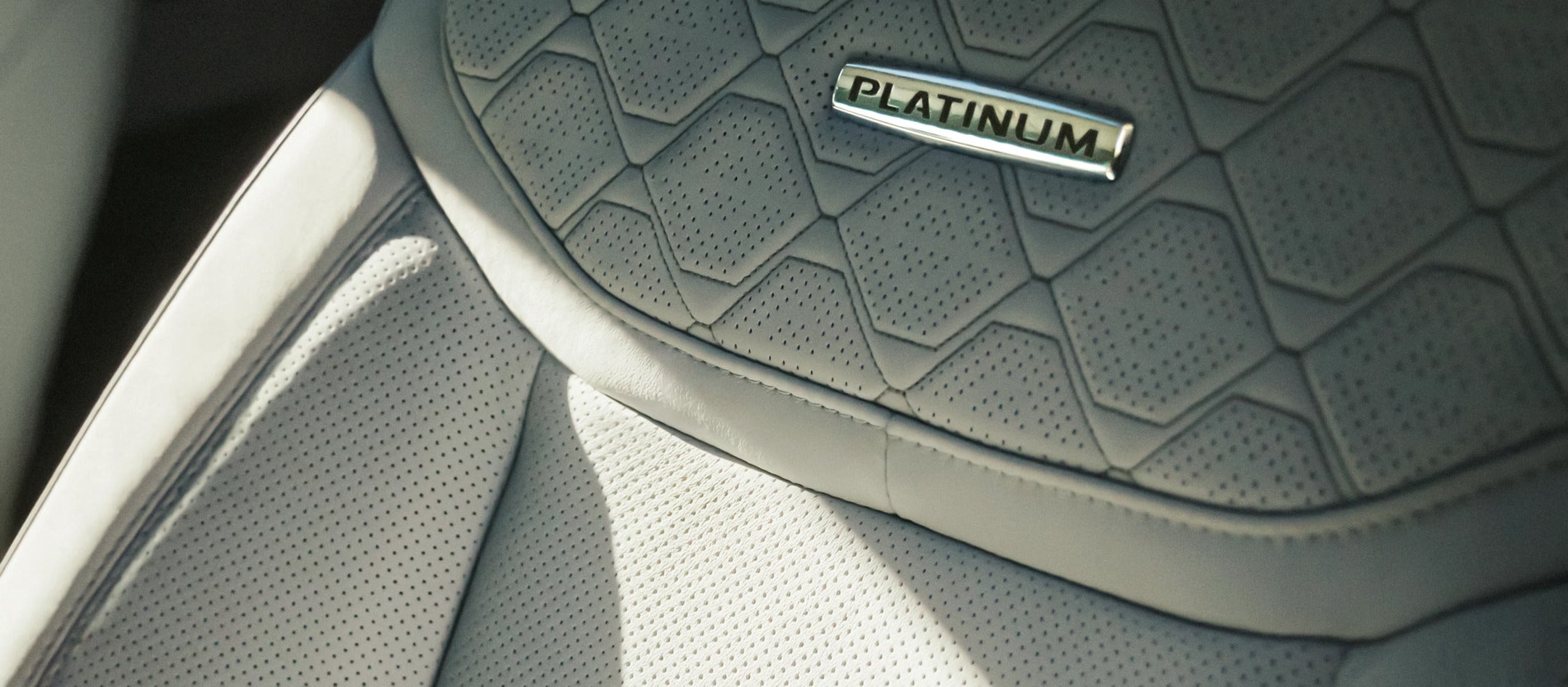 platinum logo on interior seat of an suv