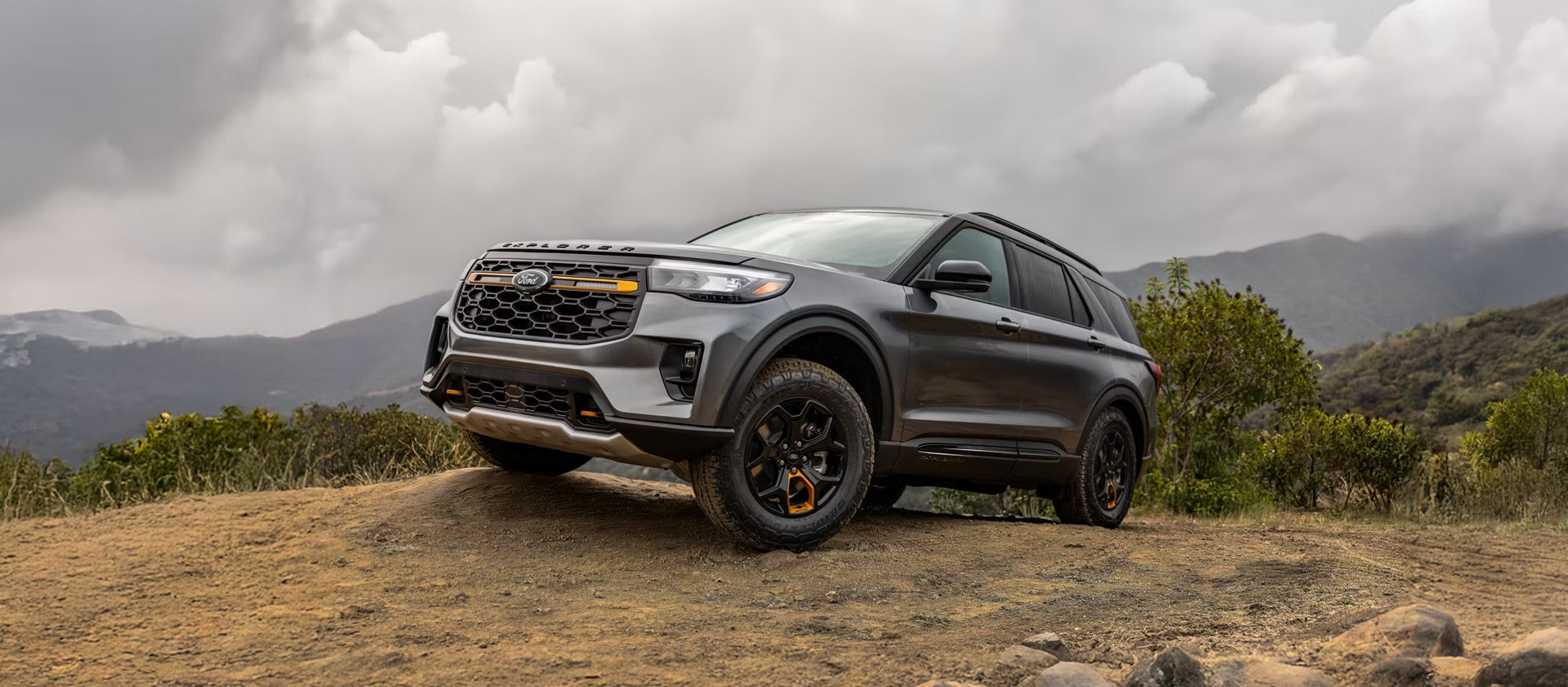 A gray suv sitting parked.